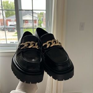 Black platform loafers